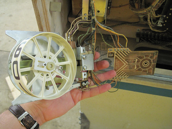 The score reel disassembled for cleaning.