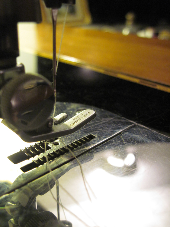 A closeup of the presser foot, which reads "45321 / SIMANCO USA."