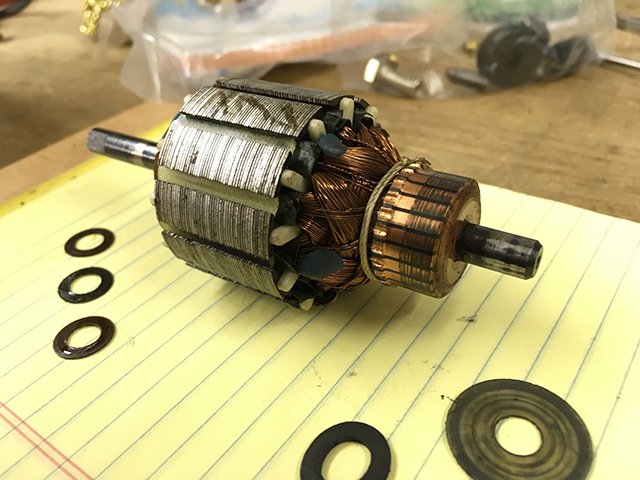 The rotor of the Alphasew motor, with the shim washers resting in the foreground.