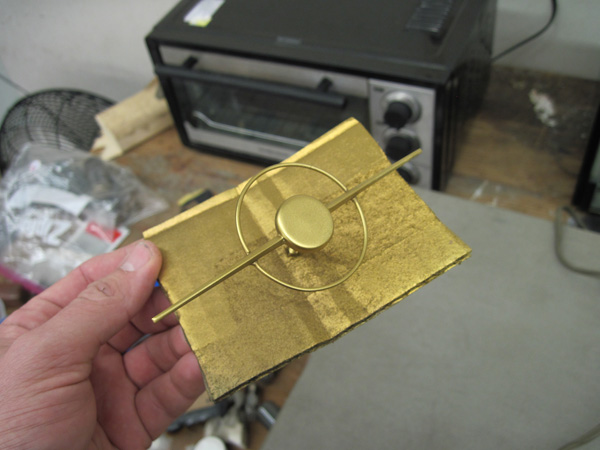 The repaired and repainted dial pointer.