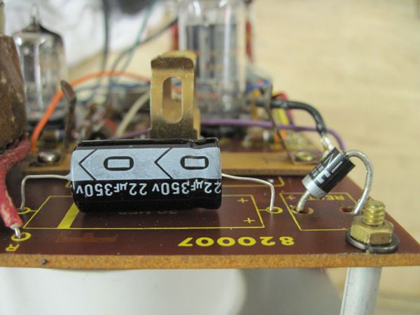 A view of the printed circuit board with a brand new 22uF electrolytic filter cap and a large diode.